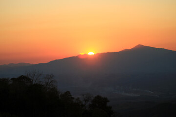 Obraz premium Beautiful sunrise over the mountains with mist, sky and cloud. Fresh and relax type nature landscape. Dramatic outdoor scene