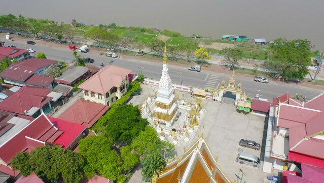 Wat Phrathat Phanom, Nakhon Phanom, Isan Temple. The pagoda is a buddhist temple in urban city town, Thailand. Thai architecture landscape background. Tourist attraction landmark.