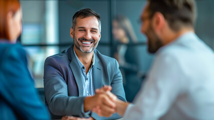 Professional handshake in a bright office.	
