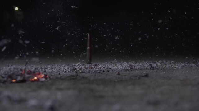 A bullet in ashes outside