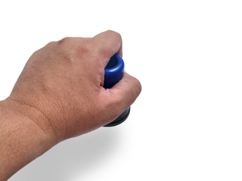 Hand holding blue handled round rubber stamp, top view isolated on white