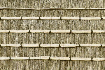 Traditional bamboo and straw fence in a Japanese garden (Retouched and color manipulated image)