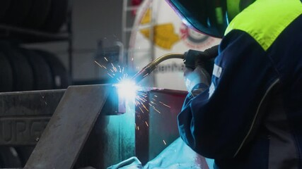 Man welding a steel frame