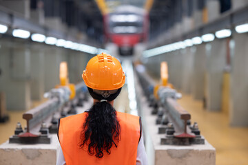 Female Locomotive Engineer in Train Depot