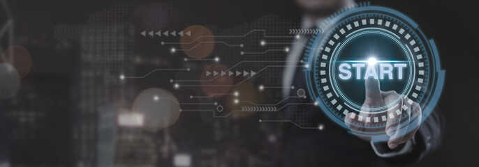 Businessman is pressing button with "Start" on futuristic virtual screen. Concept of action and progress, as the man is taking start first step towards a goal or task.