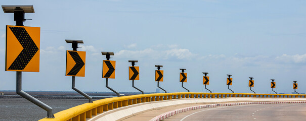 Sign curved road on the way. LED traffic signs can save electricity and save energy. Signs...