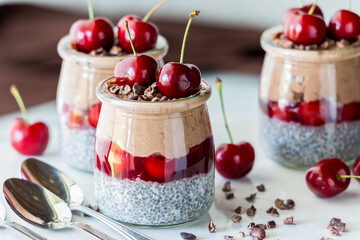 Delicious and healthy Black Forest chia puddings, ready for eating.