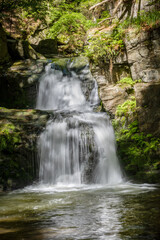 Beautiful waterfall on stony creek in sunny forest - Resovske waterfalls