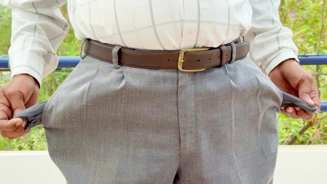 Closeup Of A Man Showing him Empty Pocket | Inflation | Unemployment concept