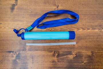 Portable water purifier filter with the option to use it directly in water or attach a bottle to...