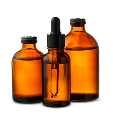Three Amber Glass Dropper Bottles With Dropper Against White Background