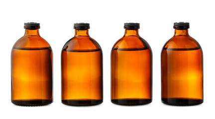 Four Amber Glass Bottles With Black Caps on a White Background