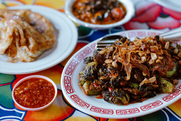 Indonesian cuisine with various dishes on a colorful table