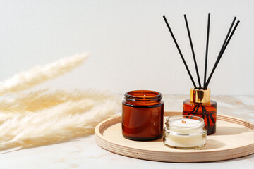 Scented Candles and Reed Diffuser on a Wooden Tray