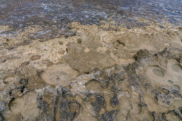  Ko Olina Beach Park, Leeward Coast of Oahu, Honolulu, Hawaii geology. Beachrock is a friable to well-cemented sedimentary rock. Salt weathering Tafoni
