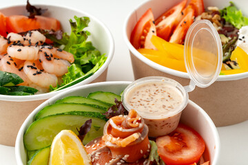 Tasty take out poke bowls isolated on white background