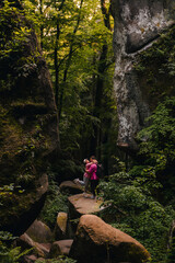 couple tourists hiking at canyon in the forest