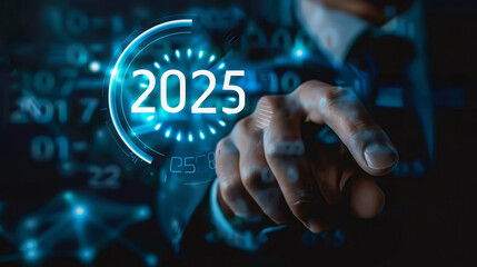 A businessman's hand reaches out to a glowing digital circle displaying the year 2025. The concept represents the future, progress, and digital innovation.