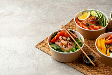 Fresh poke bowl on straw mat close up
