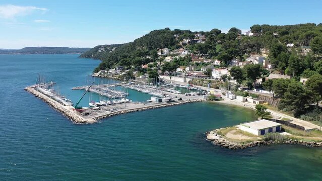 Video of a drone flying over ships on a sunny summer day at the marina in Istres Provence, France