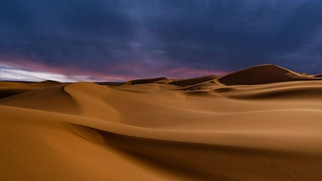 Timelapse of sunset over the sand dunes in the desert. Gobi desert