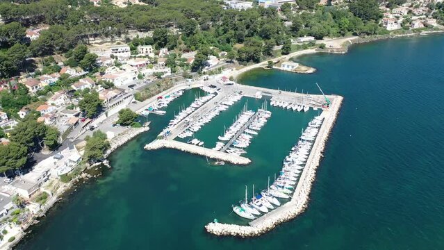 Video of a drone flying over ships on a sunny summer day at the marina in Istres Provence, France