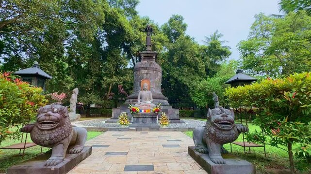 Prayer place in the Mendut temple monastery. Statues and temples with prayer equipment and decorations. Indonesia.