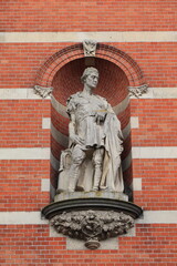 Amsterdam Stedelijk Museum Exterior Detail with Statue of a Man Standing in a Niche, Netherlands