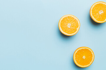 fresh Fruit orange slices on colored background. Top view. Copy Space. creative summer concept. Half of citrus in minimal flat lay with copy space