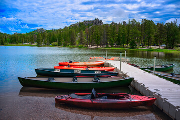Kayaks and Canoes moored at Sylvan Lake Park in Custer State Park of the Black Hills, South Dakota,...