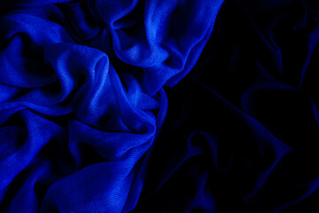 Soft fabric. Blue fabric wrinkled, interesting abstract pattern. Wallpapers and backgrounds with copy space for text,