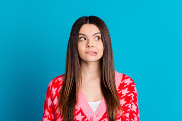 Photo of funny woman with straight hairstyle dressed knitwear cardigan biting lips look empty space...
