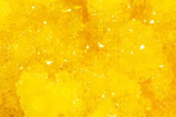 Golden crystal mineral stone. Gems. Mineral crystals in the natural environment. Texture of precious and semiprecious stones. Seamless background with copy space.
