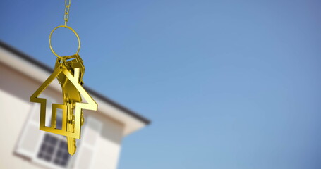 Image of golden key and house over house and blue sky