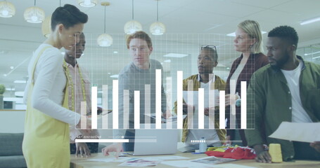 Image of graph and loading bars over diverse coworkers discussing reports on laptop in office