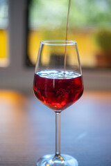 glass of red wine on the table