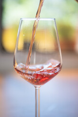 red wine pouring into glass