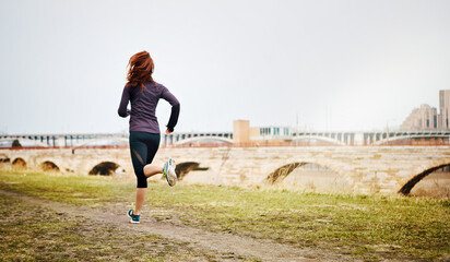 Back, woman and running by city outdoor, endurance and speed with fitness in Germany. Training, female runner and preparation for marathon, challenge and exercise with workout in nature by mockup