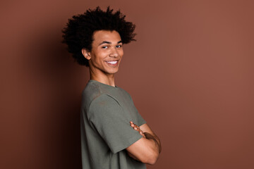 Photo portrait of attractive young man crossed hands confident profile dressed stylish khaki...