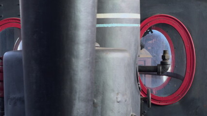 Old Train Engine Resembling a Human Face With Windows and Chimney