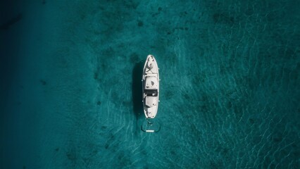 Top view of a blue ocean with a boat