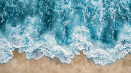 Naklejka premium An aerial photograph of turquoise ocean waves crashing on a sandy shore