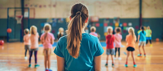 teacher female instructing children in modern school sport