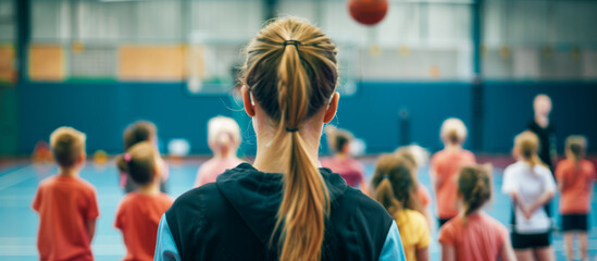 teacher female instructing children in modern school sport