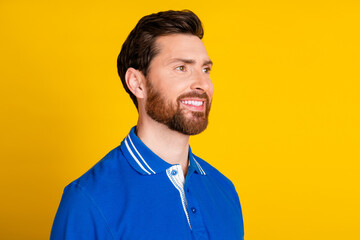 Photo portrait of pretty young male look empty space entrepreneur wear trendy blue outfit isolated on yellow color background