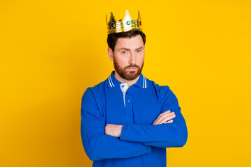 Photo portrait of pretty young male crossed hands king wear trendy blue outfit isolated on yellow...