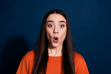 Phoot of shocked impressed cute woman wear orange stylish clothes wow offer isolated on dark blue color background