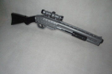 Plastic toy shot gun isolated in solid white background