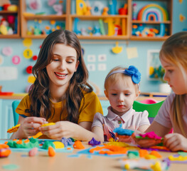 Fototapeta premium A smiling woman with two children playing with colorful clay at a table, in a playroom with a cheerful background. Generative AI