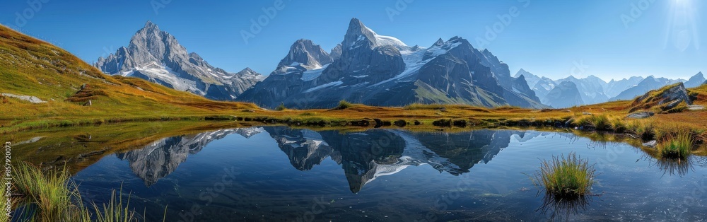 Wall mural Majestic Mountain Reflections in a Tranquil Alpine Lake on a Sunny Day - Wall murals